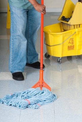 1st Choice Cleaning janitor in Upland, CA mopping floor.
